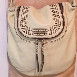 Oryany pebbled leather crossbody handbag